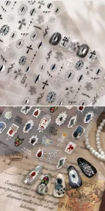 Detail view of dark gothic Halloween 3D nail stickers featuring crosses and spooky motifs
