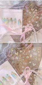 Makroansicht von geprägten 3D-Nagelstickers mit Ozeanmotiven wie Muscheln und Seepferdchen-Designs