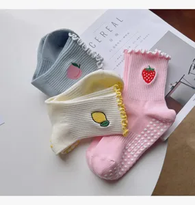 Non-slip yoga socks for women, mid-tube cotton sports socks with cute fruit embroidery and grips.