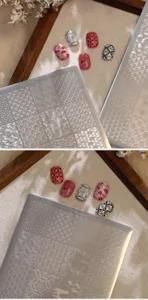 Makroansicht der Nagelstempelplatte TG-076 mit filigranen chinesischen Wolkenmustern