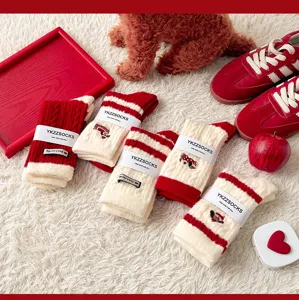 Thickened red winter long socks for women featuring cute puppy embroidery and warm velvet lining.