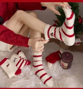 Cozy red and white striped thick fuzzy winter socks with cute puppy embroidery for women.