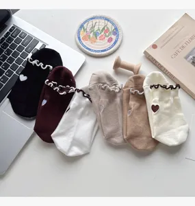 Cute ruffles short socks with heart embroidery, comfortable daily wear cotton socks detail.