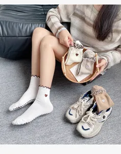 Professional non-slip yoga socks with cute ruffles and heart embroidery for daily pilates fitness.