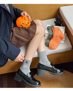 Close-up detail of Halloween mid-calf socks with cute embroidery, comfortable daily wear.
