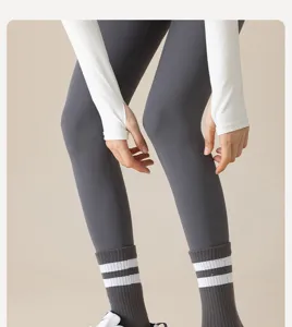Women's athletic leggings and striped mid-calf socks set, comfortable sportswear for gym and yoga.