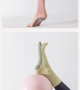 Detailed shot of five toe grip socks sole non slip dots yoga pilates workout activewear footwear