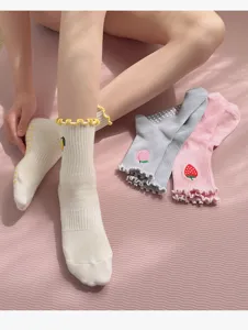 Non-slip yoga socks for women, mid-tube cotton pilates socks with cute embroidery and grips.