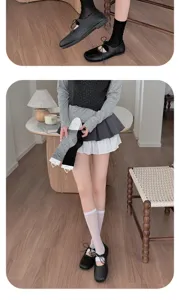 Detailed view of women summer thin ballet style footless socks and stacked leg warmers.