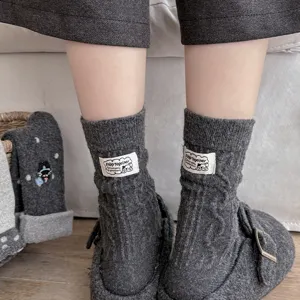 Thick grey wool knit mid-calf socks for women, warm winter slouch socks with woven label design.