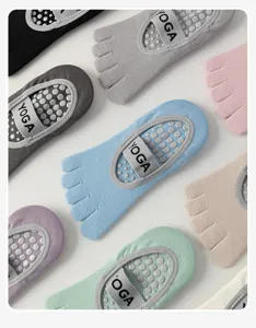Non-slip five toe yoga socks with grip dots for pilates fitness and workout wear comfort.
