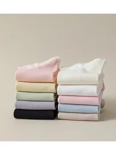 Detailed view of neatly folded pure cotton women's short socks in various pastel colors.