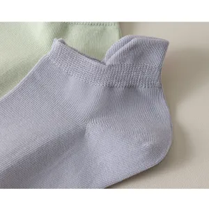 Close-up detail of soft cotton low-cut boat socks, breathable fabric, comfortable summer wear.