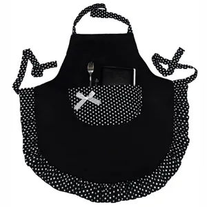 Cute black polka dot apron with ruffle hem and bow detail designed for kitchen and restaurant use.