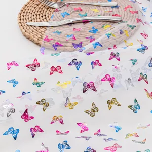 Sheer white tablecloth with colorful foil butterfly print, perfect for party and dining table decor.