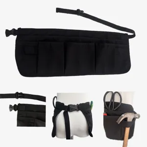 Multi-pocket tool waist apron detail, adjustable belt with quick-release buckle for work.