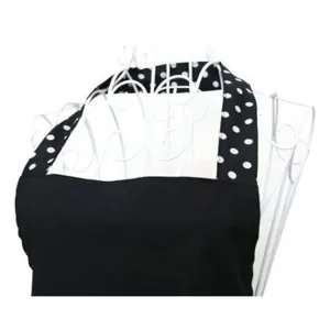 Black and white polka dot apron with halter neck design, stylish kitchen and dining wear.