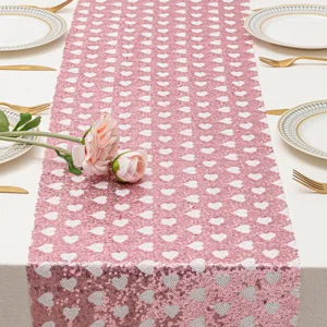 Camino de mesa de lentejuelas con corazones rosas para fiesta de San Valentín boda y decoración.