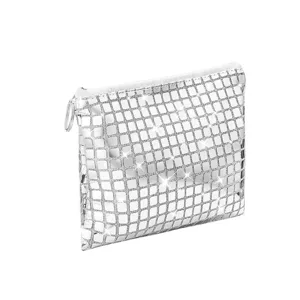 Detailed close-up of silver glitter cosmetic pouch, sparkling grid pattern zipper makeup bag.