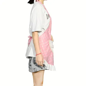 Pink polka dot apron with pockets and ruffles, cute kitchen cooking coverall for home.