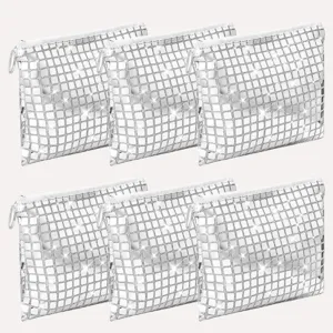 Details of the silver sequin cosmetic bag, showing sparkle texture and smooth zipper closing.