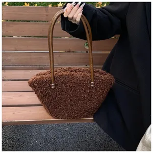 Chic brown faux lamb wool fuzzy tote bag for women, perfect for autumn and winter styles.