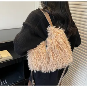 Fluffy shearling shoulder crossbody bag with metal lock detail, cozy autumn winter accessory.
