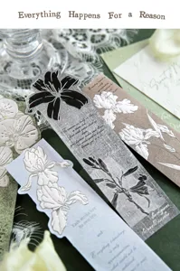 Detail view of vintage embossed floral bookmarks featuring elegant poetic inscriptions.