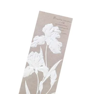 Vintage embossed floral bookmark with elegant white iris pattern and poetic text