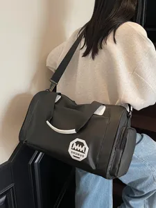 Large capacity black travel gym bag made of waterproof material featuring SHUNUO logo