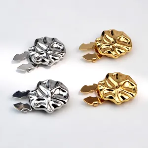 Detail view of stylish metal irregular shirt clips and collar fasteners in silver and gold.