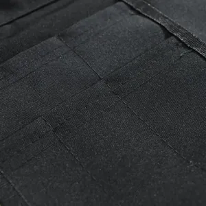 Grembiule da lavoro nero multi-tasche marsupio utilità per trucco e ferramenta professionale.