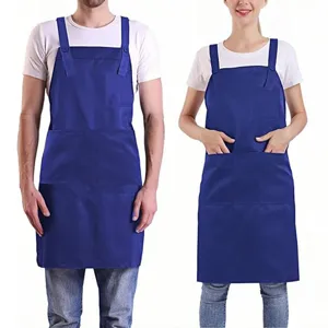 Detail view of the adjustable polyester work apron with useful pockets for staff and chefs.