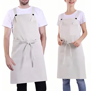 Adjustable cross back apron detail showing fabric texture, pocket, and waist tie design.