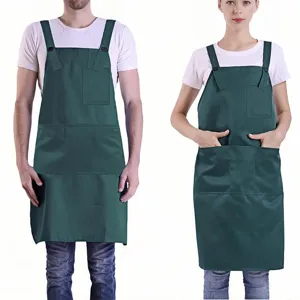 Adjustable green work apron detail featuring multiple pockets and durable fabric for use.
