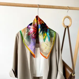 Silk square scarf detail, artistic floral print, luxurious smooth texture, elegant neck accessory for women.
