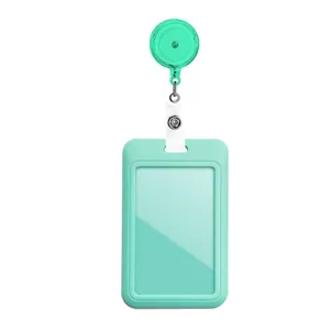 Close-up detail of mint green retractable badge reel and ID card holder for daily use.