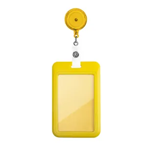 Yellow retractable badge reel and ID card holder detail view, durable plastic construction.