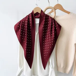 Elegant dark red polka dot triangle scarf, premium satin feel, versatile fashion accessory.