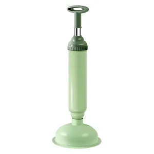Green manual air pressure toilet plunger drain unblocker pump for bathroom cleaning.