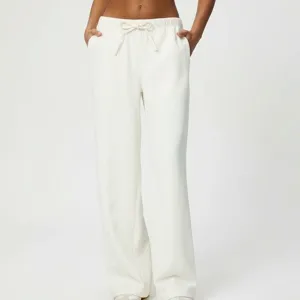 Comodi pantaloni bianchi larghi a gamba larga con coulisse per abbigliamento casual donna