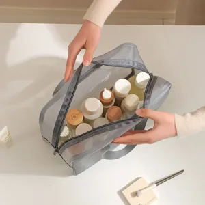 Grey mesh cosmetic bag with portable handle, ideal for travel, swimming, and daily toiletries storage.