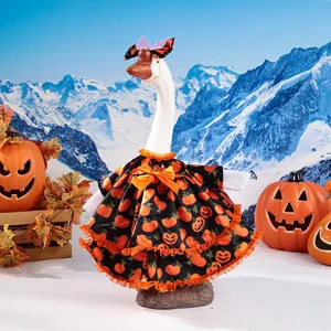 Halloween porch goose outfit with cute pumpkin dress and bow headband for holiday decoration.
