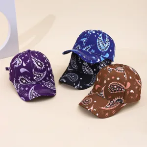Detailed close-up of trendy paisley tie-dye baseball caps in multi-colors, soft fabric design.