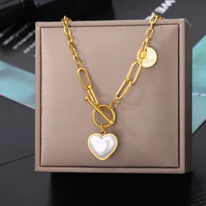 Gold-tone paperclip chain necklace with white heart pearl pendant and toggle clasp.