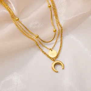 Exquisite multi-layered gold necklace featuring delicate star and moon pendants for women.