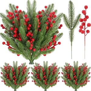 Artificial pine branches with red berries for Christmas home wedding party holiday decoration.