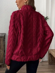 Detailed view of women casual half zip fleece sweatshirt in dark red with textured jacquard.