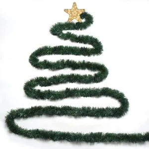 Christmas green tinsel garland hanging decoration with star topper for holiday party decor.
