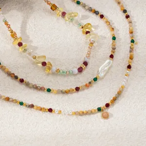 Natural stone bead necklace layered detail shot, trendy chic pearl jewelry for women.